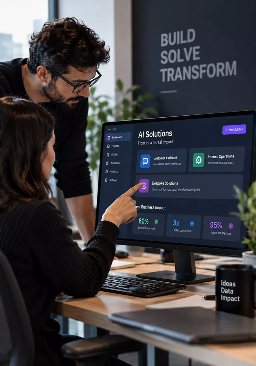 a-person-works-at-a-standing-desk-with-a-monitor-displaying-the-words-build-solve-transform